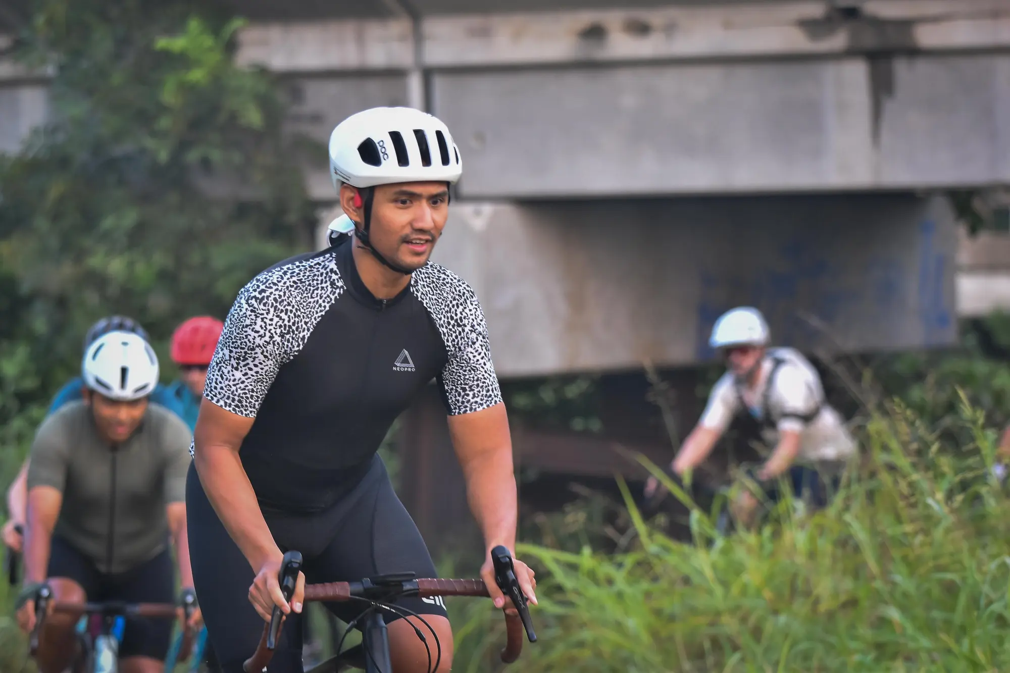 Charity ride participant riding around the curve